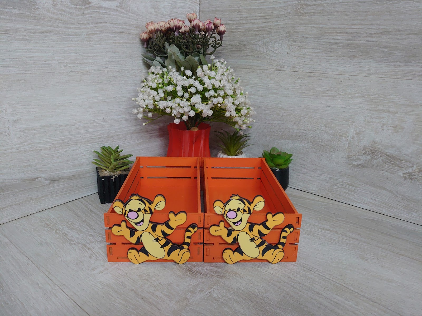 Orange painted wooden crate with character cutout